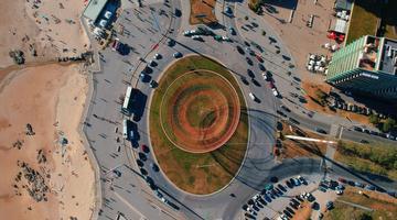A photo of a roundabout near what looks like a beach