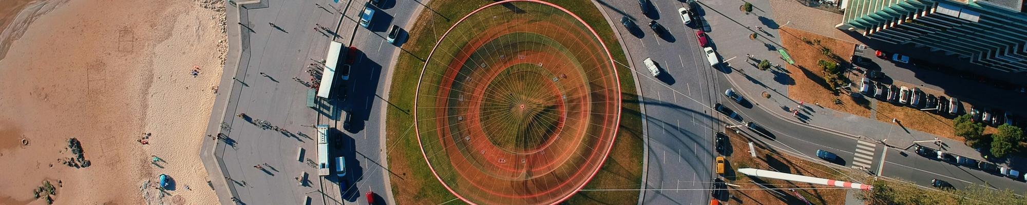 A photo of a roundabout near what looks like a beach